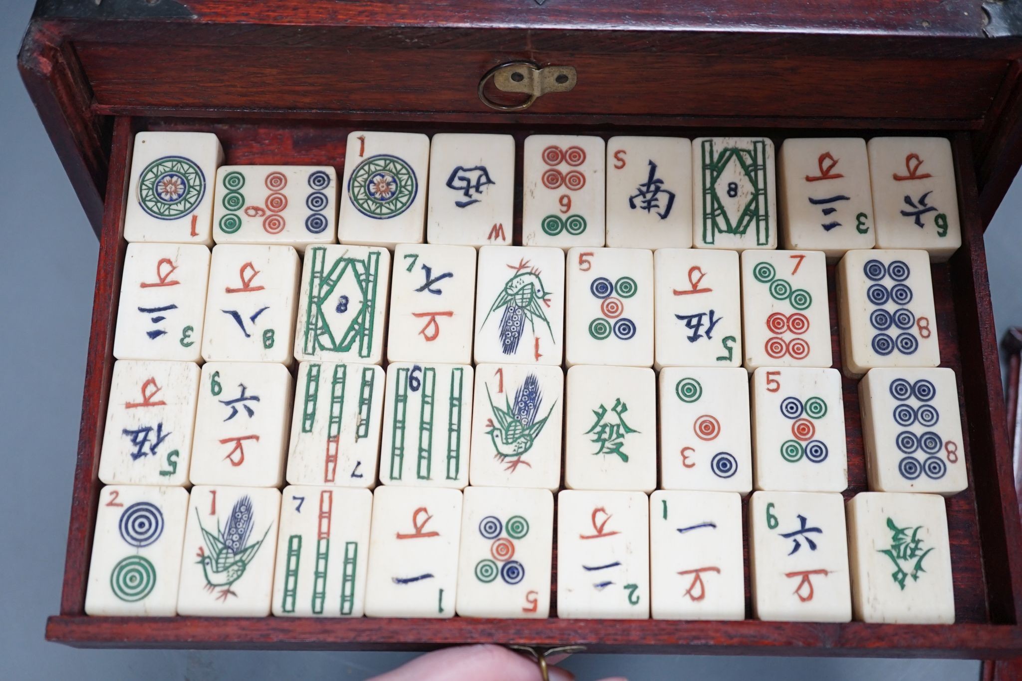 A MahJong set and a Chinese brass mounted card case., MahJong set, 15.5 cms high x 23.5 cms wide.